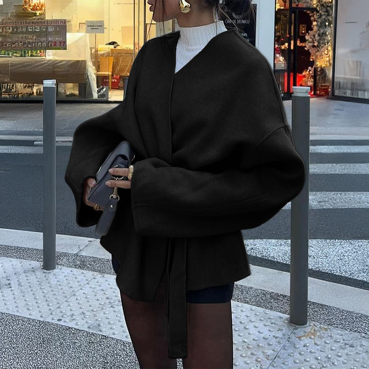 Women’s light wrap coat with tie belt, dropped sleeves and feminine waist emphasis Mune Fashion