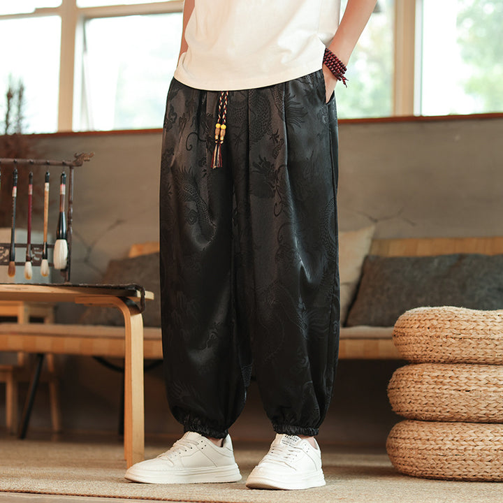 Men's wide Jacquard satin harem pants with drawstring, elastic cuffs, and traditional dragon motif Mune Fashion