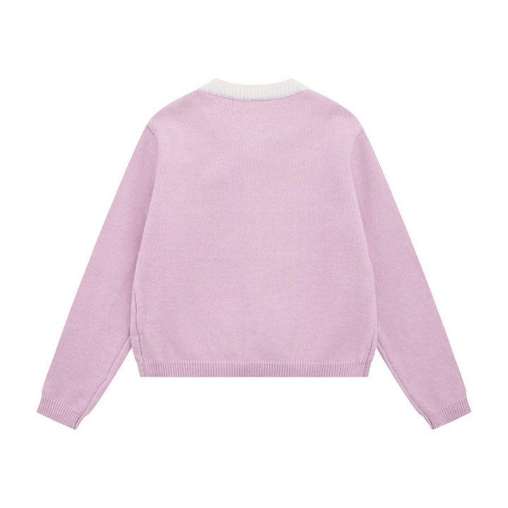Ladies fine knit cardigan with round neckline, concealed button placket, and decorative brooch Mune Fashion
