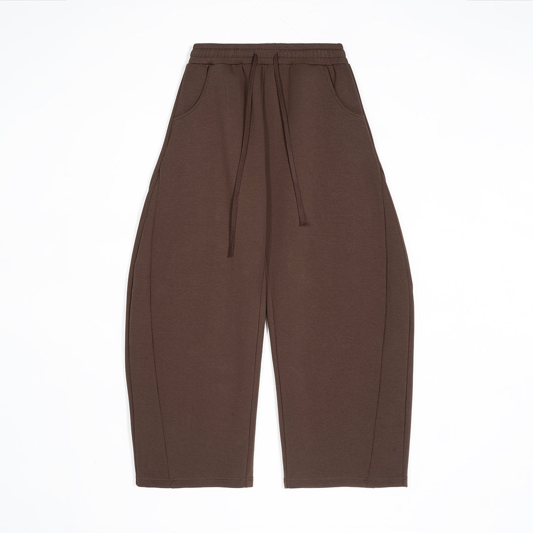 Women wide-cut jogging pants with elastic waistband, drawstring and side pockets Mune Fashion