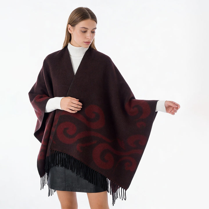 Women's wool blend poncho with jacquard swirl pattern, V-neck and fringes