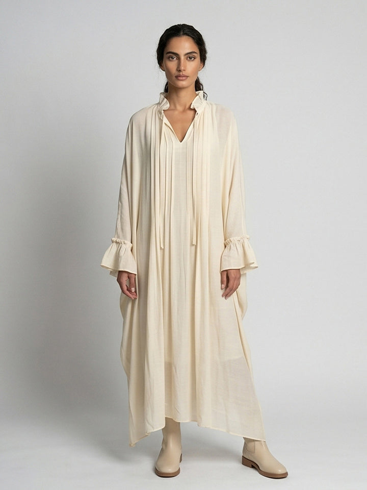 Women's maxi dress in kaftan style with ruffled collar, tie straps, and voluminous sleeves Mune Fashion
