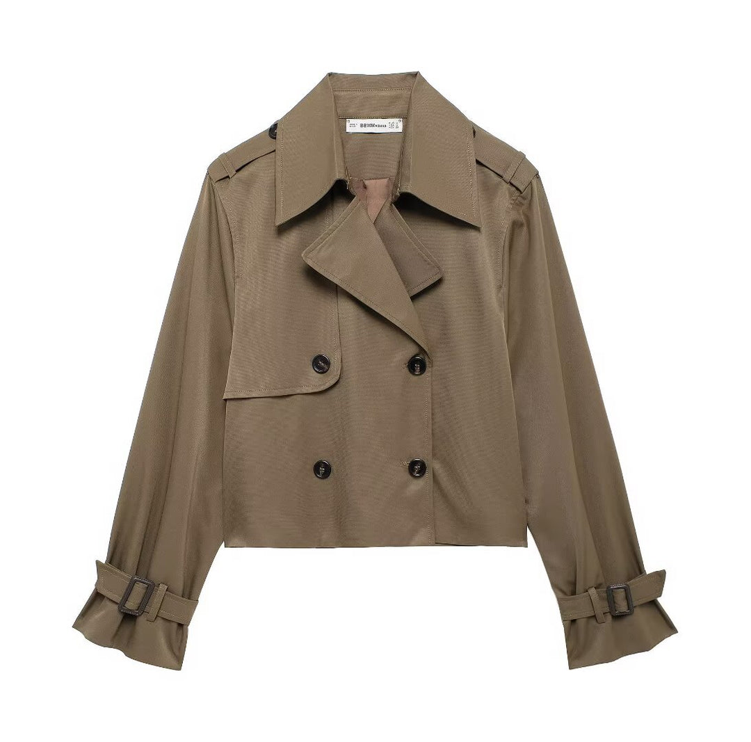 Women's short cropped trench coat in boxy cut with double-breasted button placket, shoulder epaulets and adjustable sleeve straps Mune Fashion