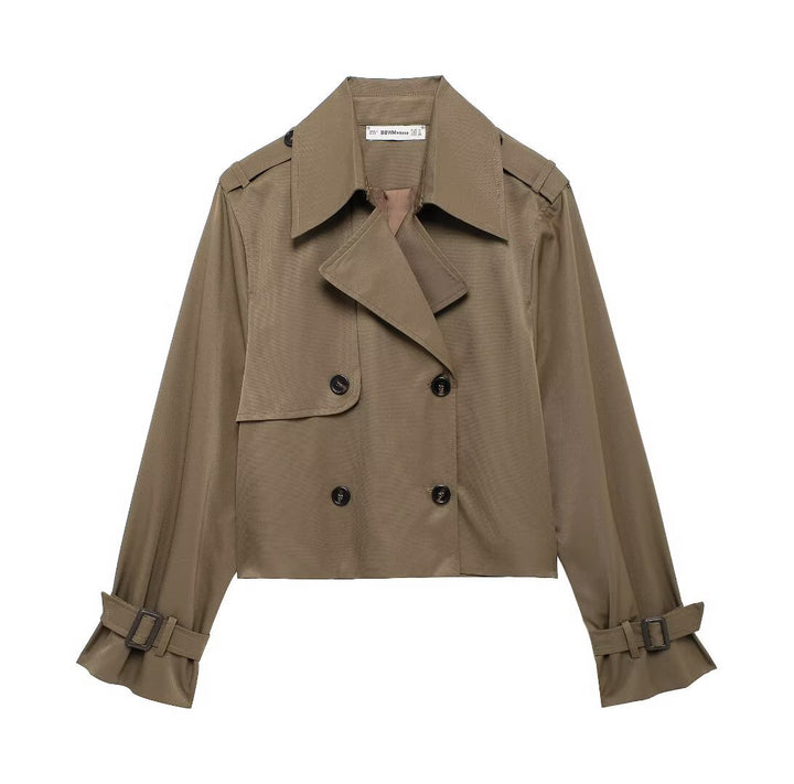 Women's short cropped trench coat in boxy cut with double-breasted button placket, shoulder epaulets and adjustable sleeve straps Mune Fashion