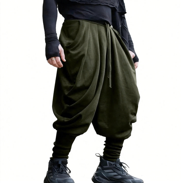 Men's avant-garde harem pants with wrap front, elastic waistband, and slim ankles Mune Fashion