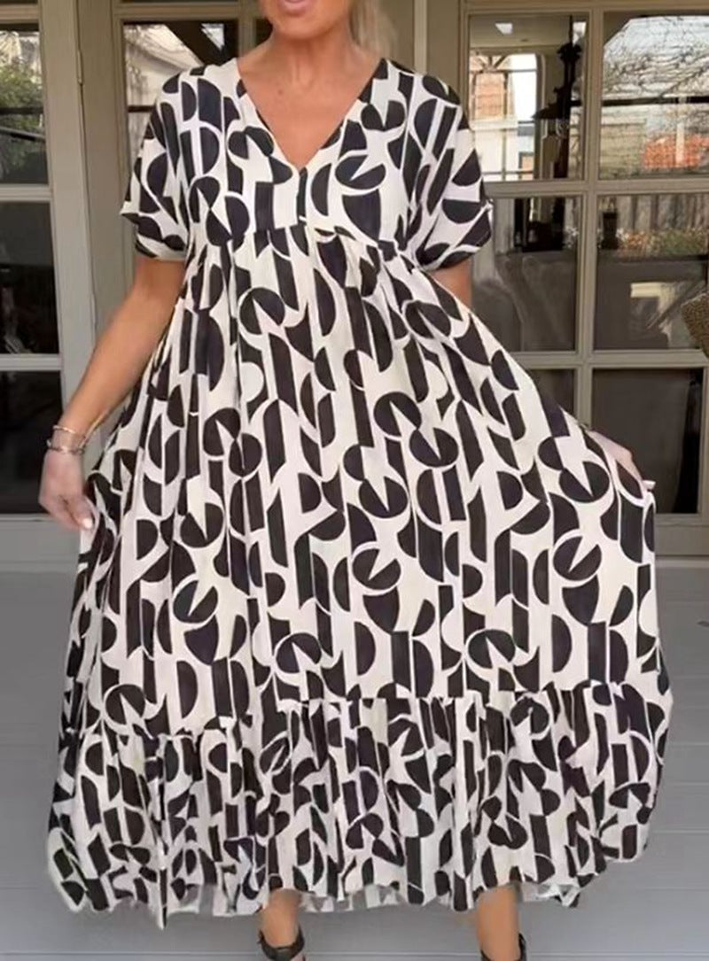Women's voluminous maxi dress with under-bust seam, V-neck, short kimono sleeves, and tiered ruffle Mune Fashion