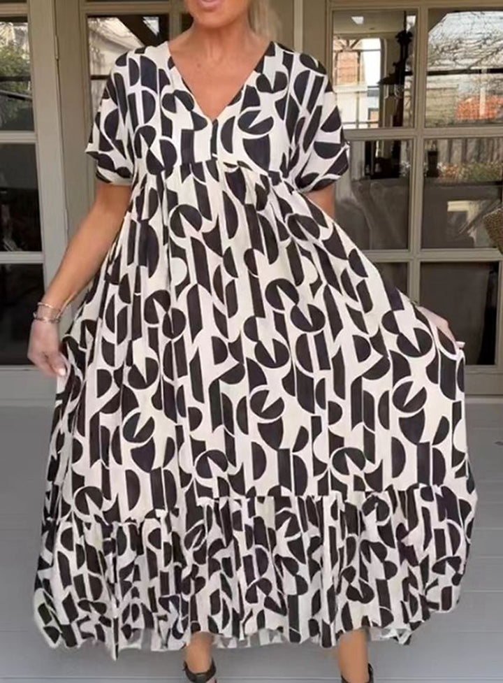 Women's voluminous maxi dress with under-bust seam, V-neck, short kimono sleeves, and tiered ruffle Mune Fashion