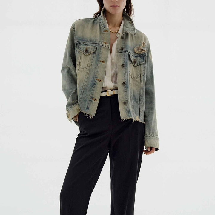Women’s oversized destroyed denim jacket with raw hem, patch chest pockets, and vintage wash Mune Fashion