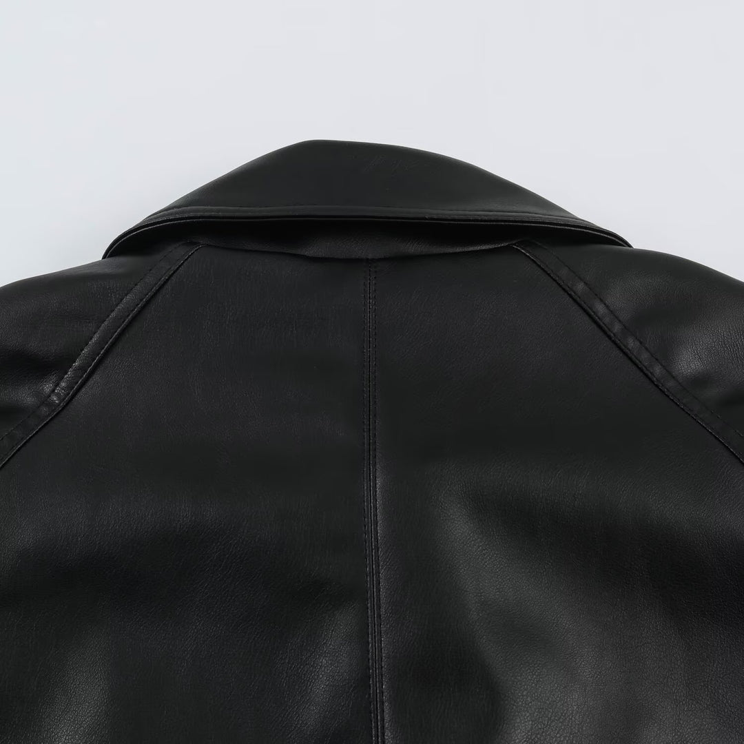 Women’s short jacket made of faux leather with a waist belt and oversized sleeves Mune Fashion