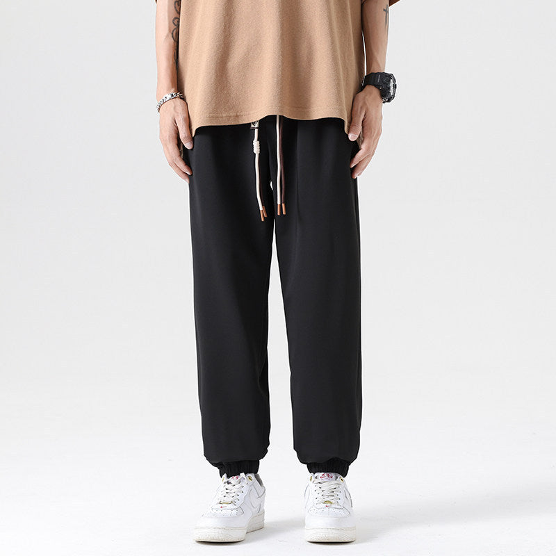 Men's Wide Jogging Pants in a Loose Fit with Adjustable Drawstring, Elastic Ankle Cuffs, and Soft Touch Mune Fashion