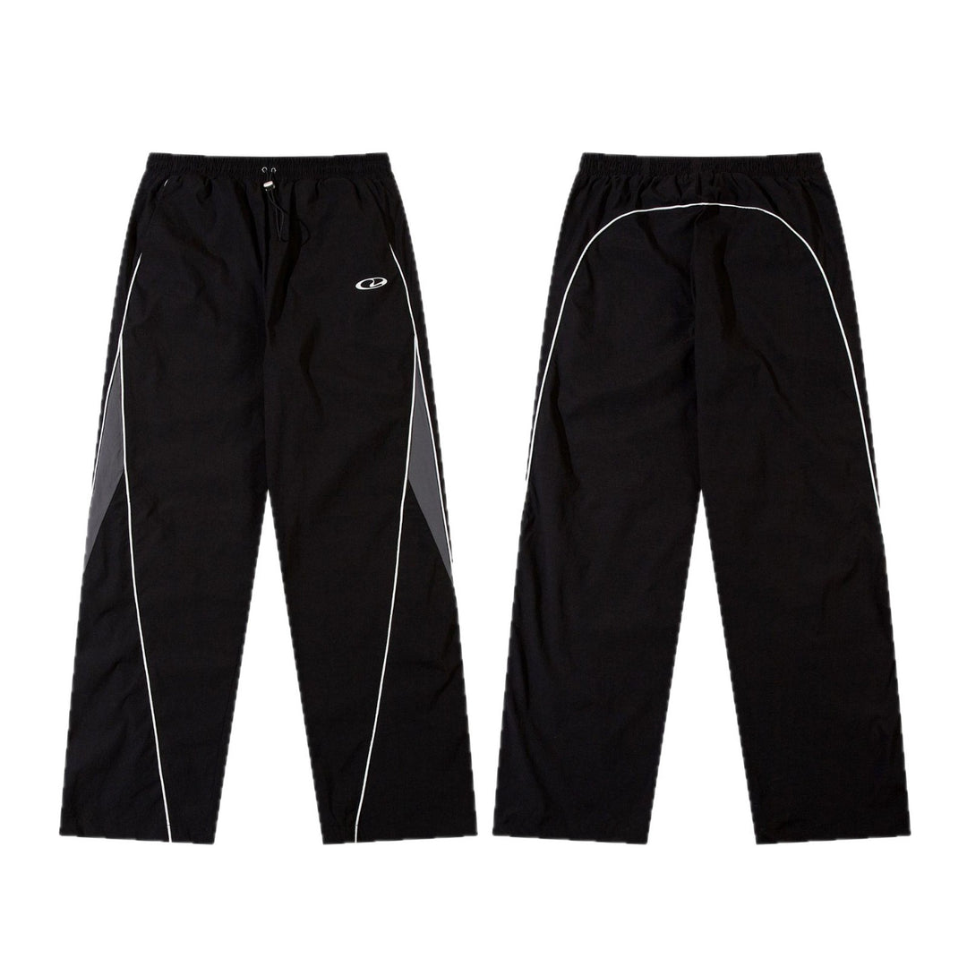 Men's sporty jogging pants with elastic waistband, side contrast piping, and straight cut Mune Fashion