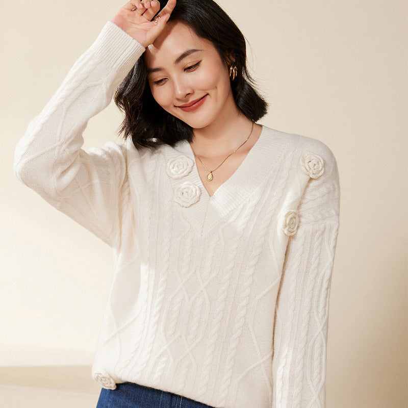 Women's cable knit V-neck sweater with three-dimensional floral appliqués made from soft wool blend Mune Fashion