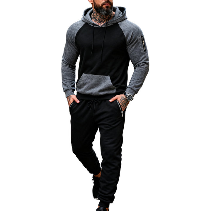 Men's two-piece hooded sweat set with raglan sleeves, sleeve zip pocket, and tapered jogging pants Mune Fashion
