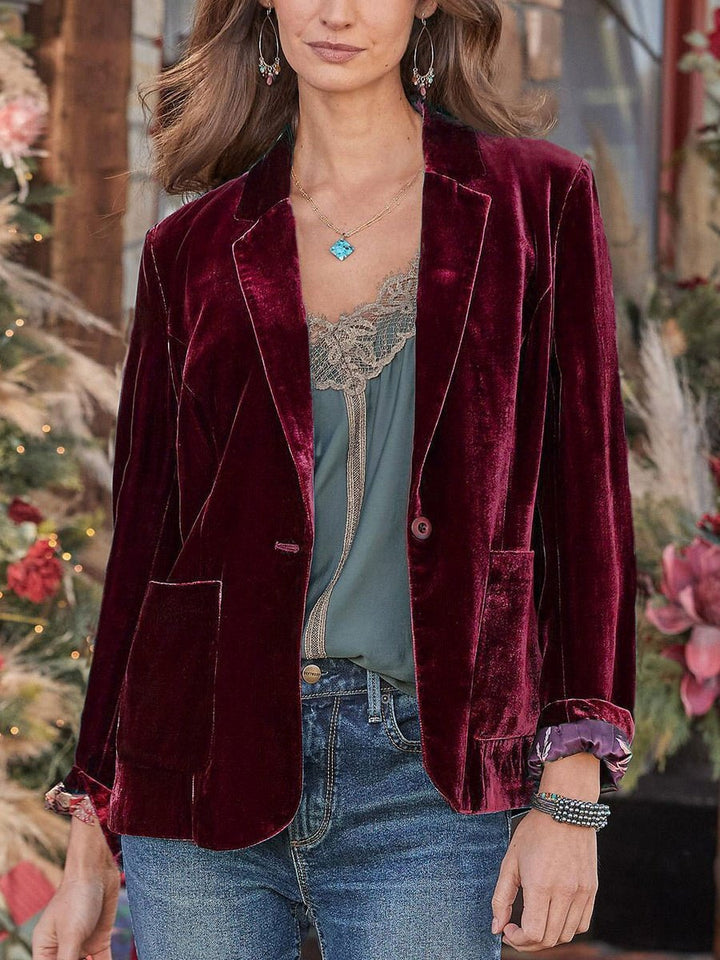 Women's velvet blazer with classic lapels and soft drape