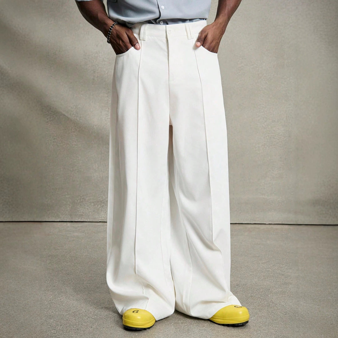 Men's wide pleated pants with high waistband, precise creases, and side inset pockets Mune Fashion
