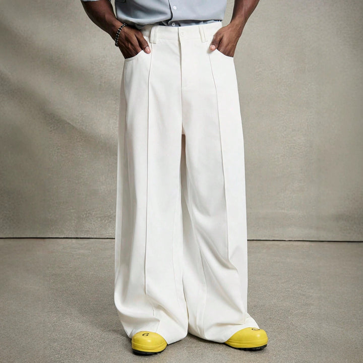 Men's wide pleated pants with high waistband, precise creases, and side inset pockets Mune Fashion
