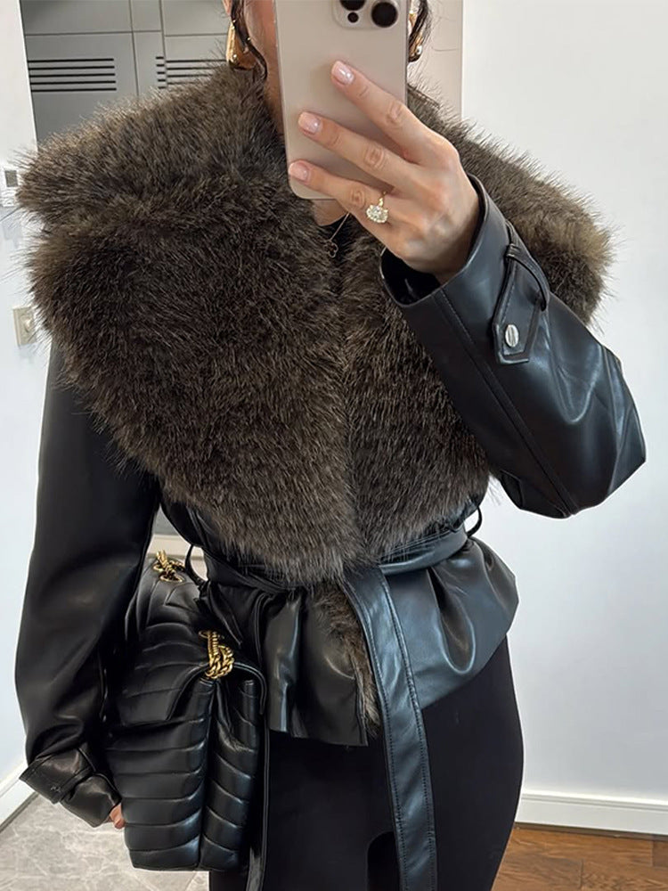 Women's tailored faux leather jacket with voluminous faux fur shawl collar and tie belt Mune Fashion