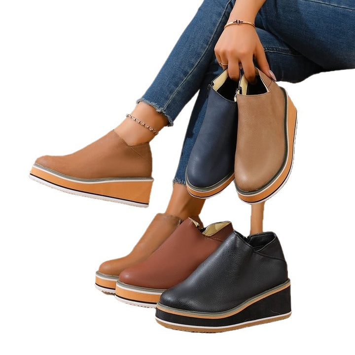 Women's Mune Fashion ankle boot with wedge heel, side zipper, and padded comfort insole