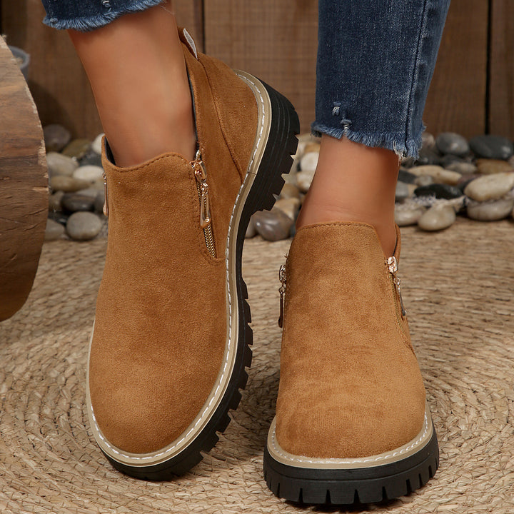 Women's ankle-high boot with decorative zipper, padded shaft, and sturdy profile sole Mune Fashion
