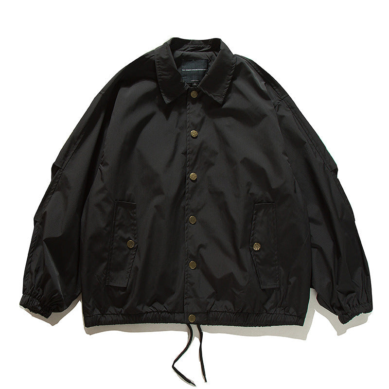 Unisex Boxy transitional bomber jacket with drawstring hem and snap button placket Mune Fashion
