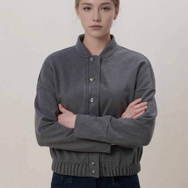 Women's cozy fleece bomber jacket with stand-up collar, ribbed hem, and snap button placket Mune Fashion