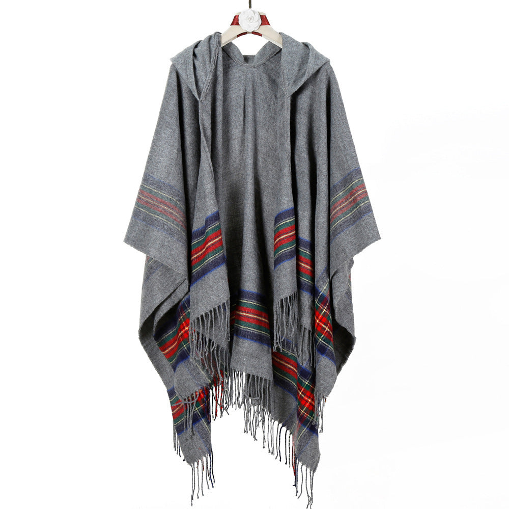 Women's hooded cape poncho in tartan pattern with fringed hem made of soft wool blend Mune Fashion