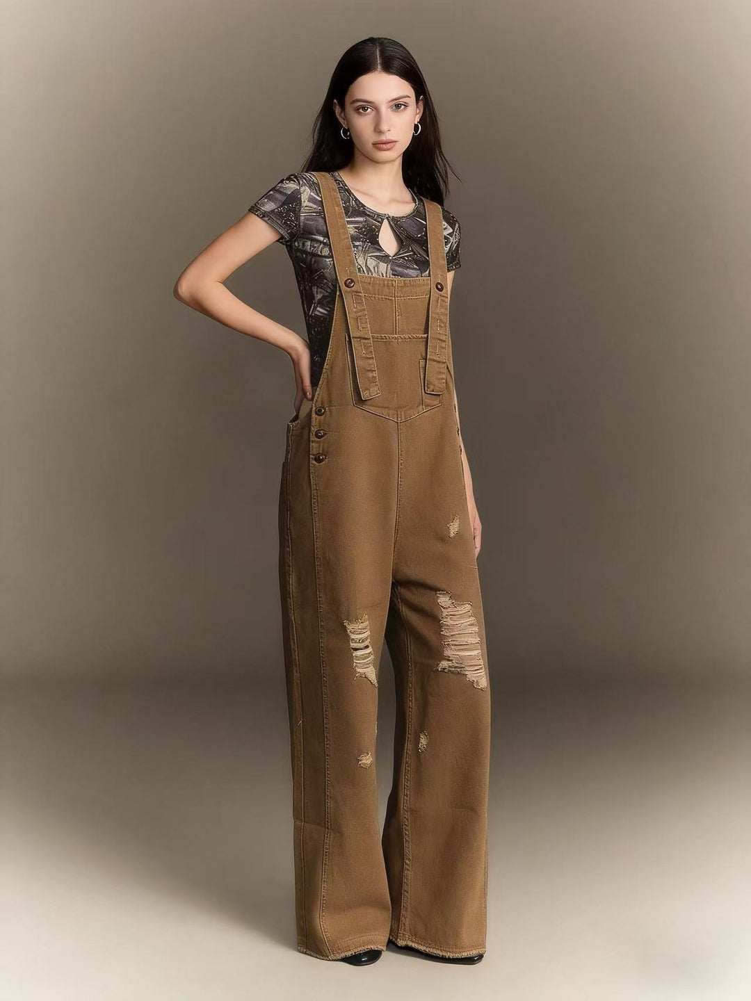 Women's modern baggy overalls made of pigment-dyed stretch denim with adjustable straps and visible rips Mune Fashion