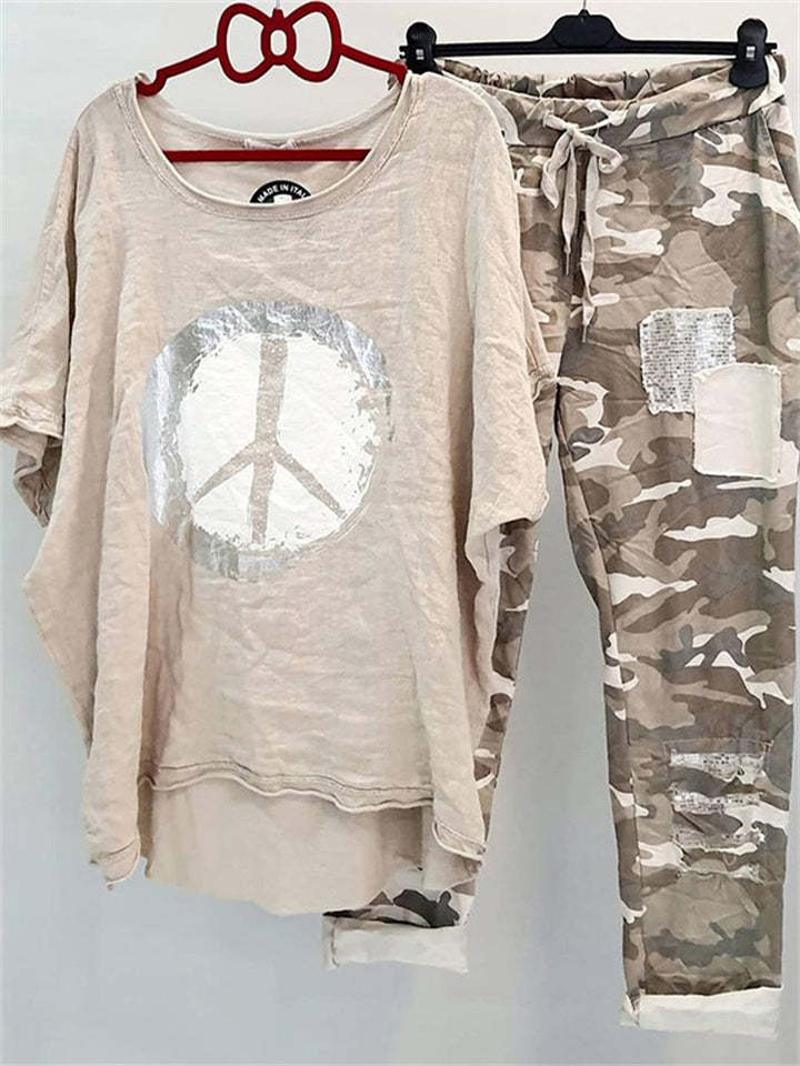 Women’s casual leisure two-piece with wide-cut linen look shirt, peace symbol and camouflage jog pants with patch details Mune Fashion