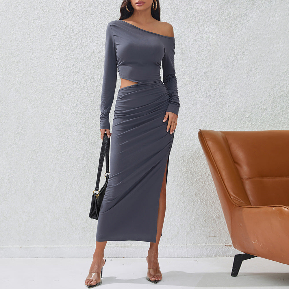 Women's a fitted maxi dress with long sleeves, side cut-out, gathered hip, and high leg slit.
