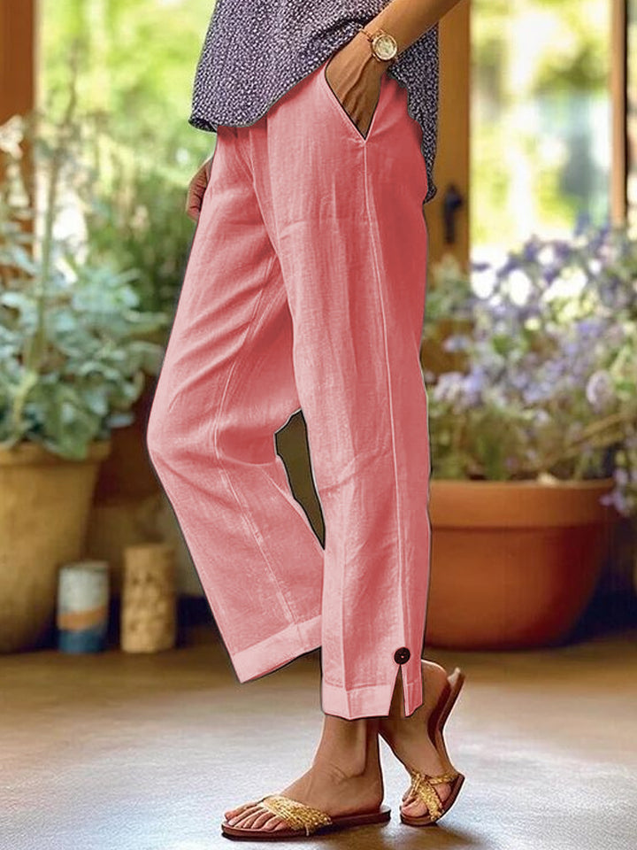 Women's linen trousers with a relaxed, ankle-length fit, side pockets and decorative button details Mune Fashion