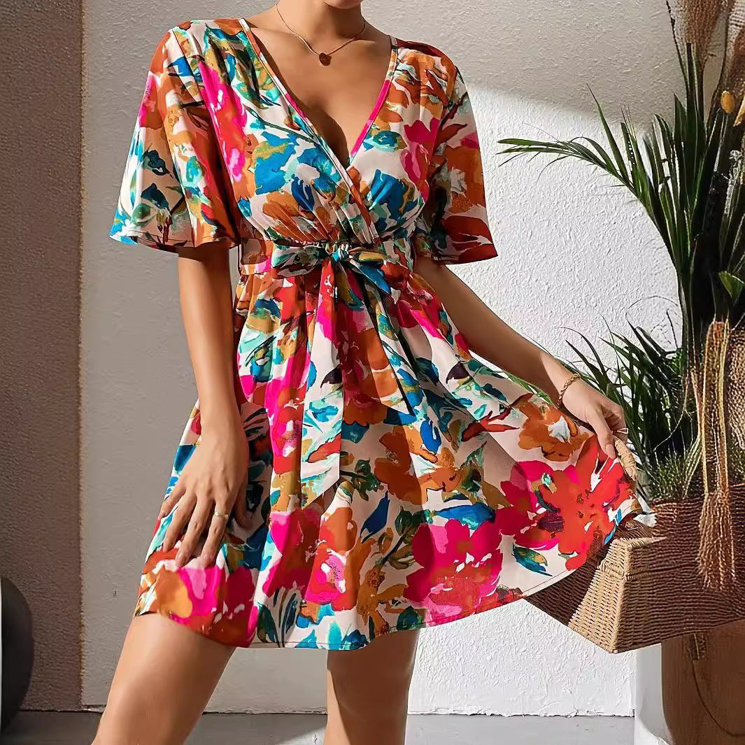 Women's wrap mini dress with deep V-neck, waist lacing, and wide trumpet sleeves Mune Fashion