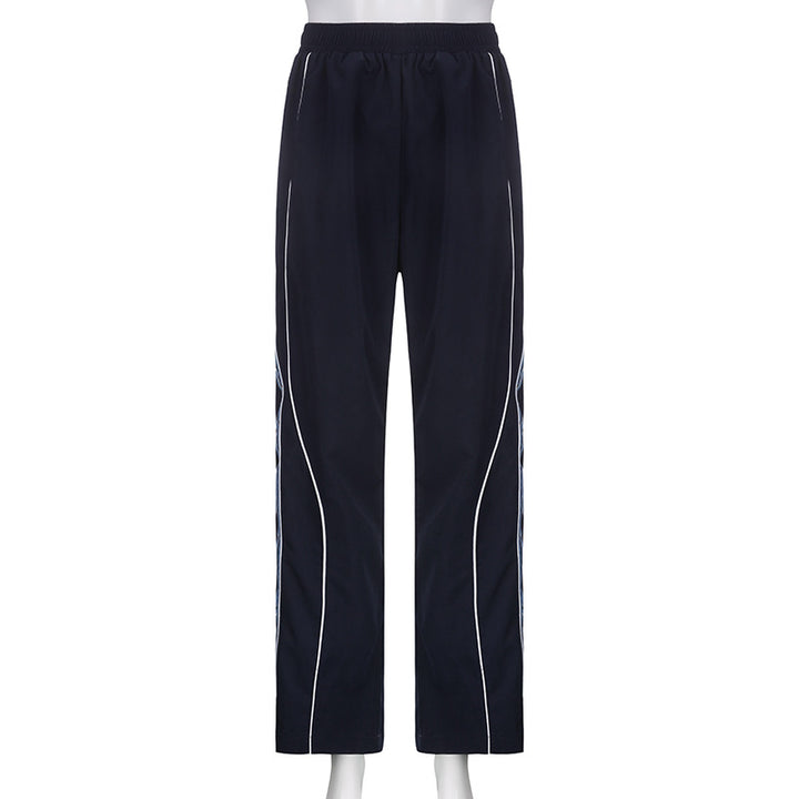 Ladies' sporty training pants with straight leg, elastic comfort waistband, and decorative side piping Mune Fashion
