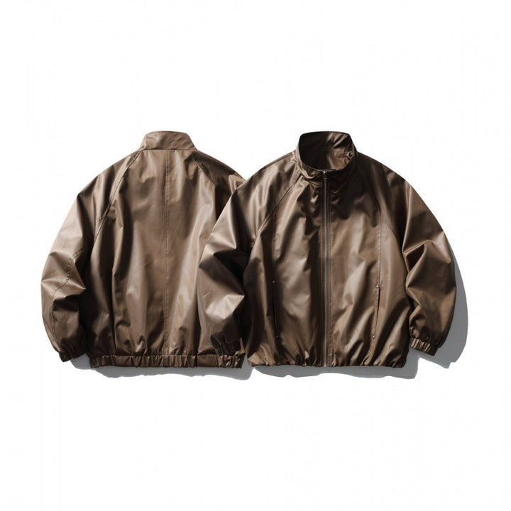 Men's short cut faux leather bomber jacket with stand-up collar, raglan sleeves, and elastic hem Mune Fashion