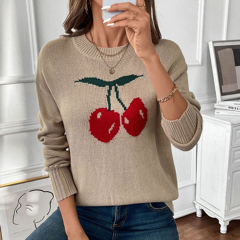 Women’s knitted sweater with cherry intarsia, round neck and casual oversized fit Mune Fashion