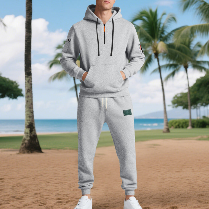 Men's half-zip hoodie and tapered jogger set with kangaroo pocket, zipper details, and elastic drawstring waistband Mune Fashion