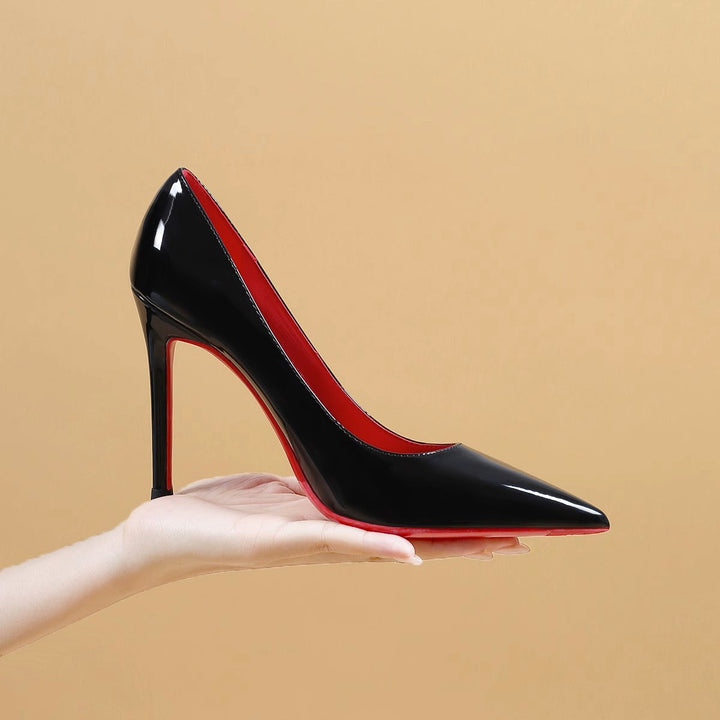 Ladies' pointed pumps with high stiletto heel and strap