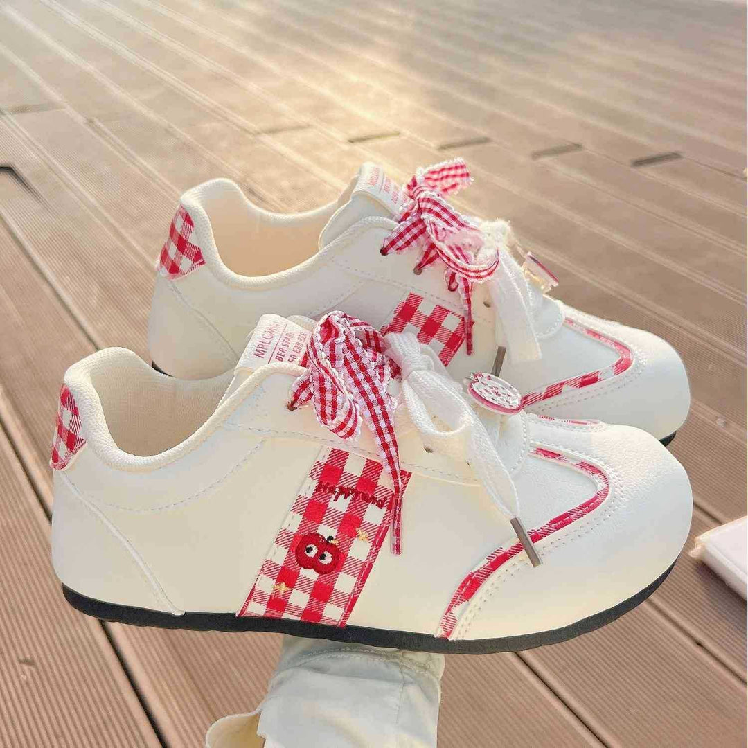 Women's sneakers with playful check pattern and decorative bows Mune Fashion