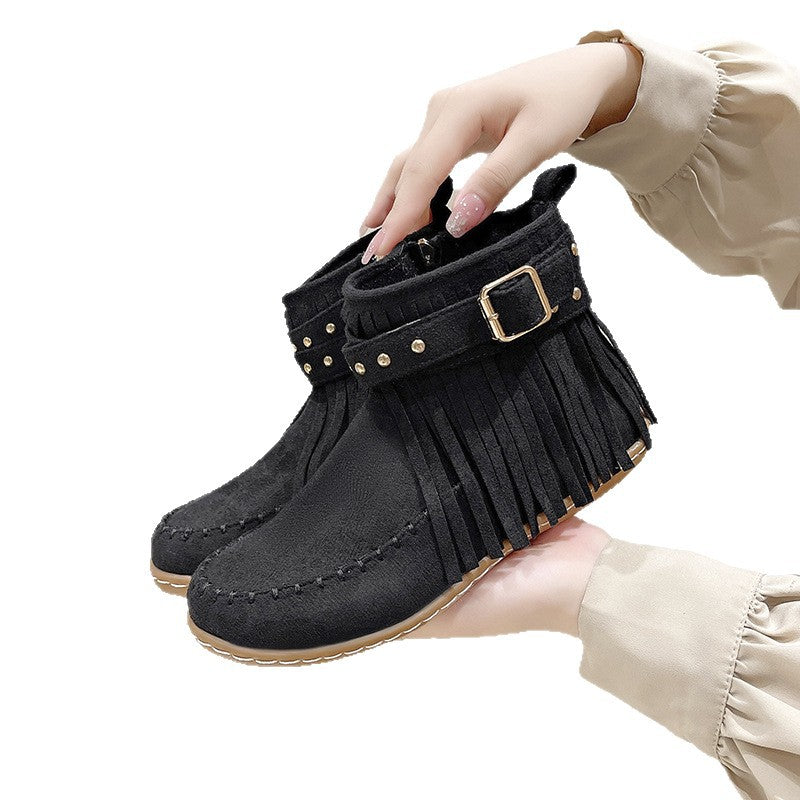 Women's fringe ankle boot in moccasin style with decorative studs, buckle strap, and side zipper Mune Fashion