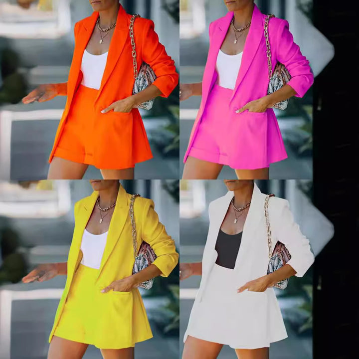 Women's form-fitting long blazer and high-waisted shorts set with dropped shoulders and patch pockets Mune Fashion