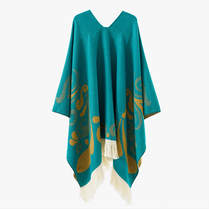 Women's wool blend poncho in cape style with V-neck, contrasting ornament jacquard and fringes.