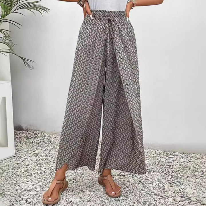 Women's wide summer palazzo pants with gathered comfort waistband, flowing leg width and geometric all-over pattern Mune Fashion