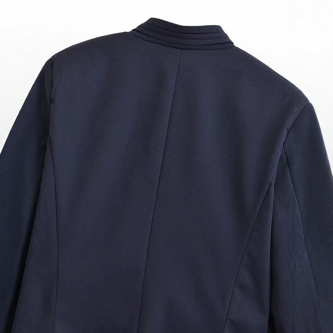 Women's short blazer with stand-up collar, gold-colored decorative buttons, and patch pockets Mune Fashion