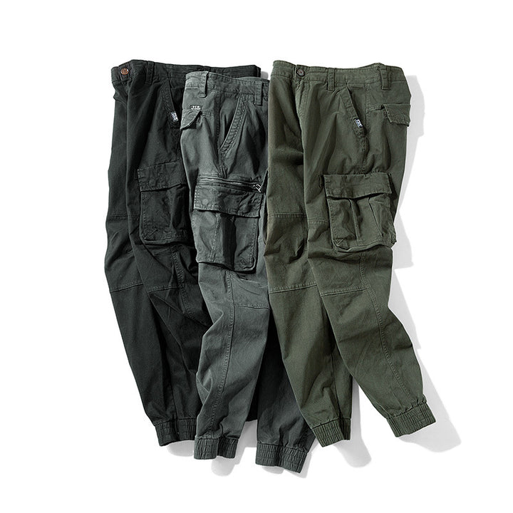Men's tapered cargo pants in jogger style with knee patches, multiple pockets, and elastic ankle cuffs Mune Fashion