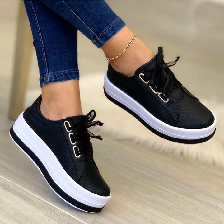 Ladies' platform lace-up shoe with extra high rubber platform, metallic eyelets, and padded entry Mune Fashion
