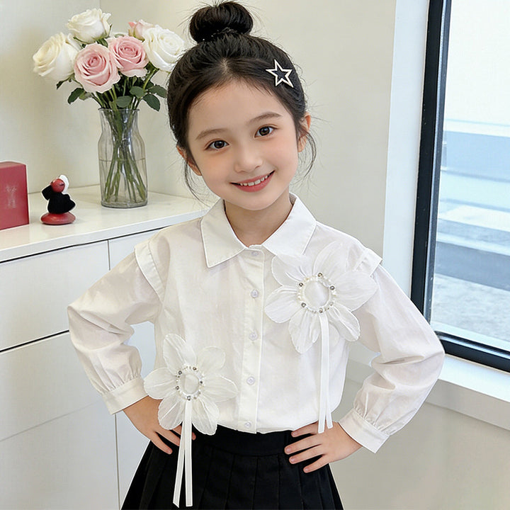 Girl's blouse with floral appliqués and elegant ruffle details Mune Fashion