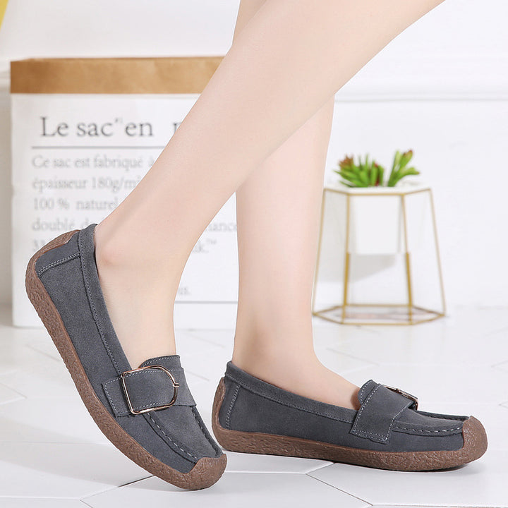 Women's moccasin slippers made of suede leather with decorative metal buckle, padded footbed, and non-slip rubber outsole Mune Fashion