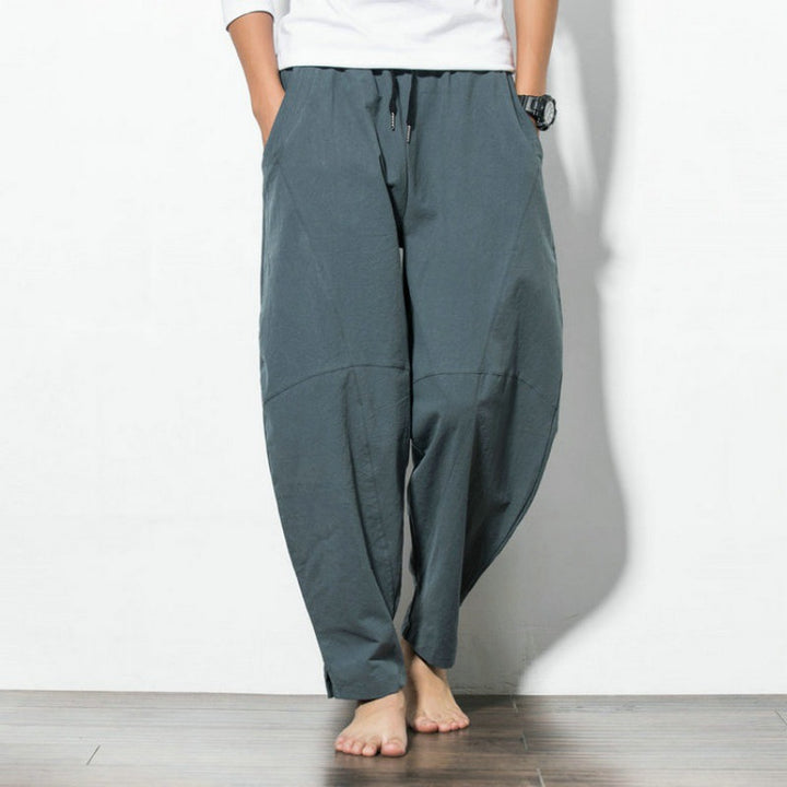 Men's loose harem pants made of cotton blend with elastic waistband, drawstring and side pockets Mune Fashion