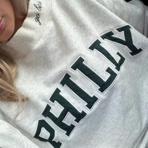 Women's oversized college sweatshirt with high stand-up collar and sewn-on lettering Mune Fashion