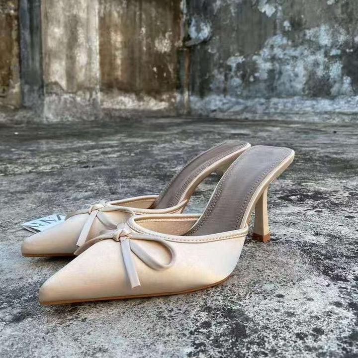 Women's pointed satin mules with delicate bow appliqué and medium-height sculpted heel Mune Fashion