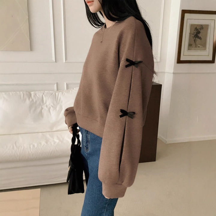 Women’s Oversize Sweatshirt with Decorative Bow Sleeves and Round Neckline Mune Fashion